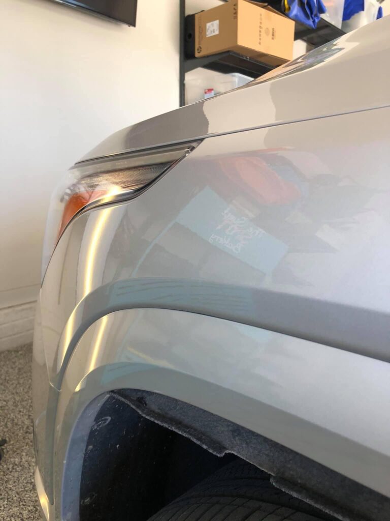After picture of paintless dent repair on a gray SUV